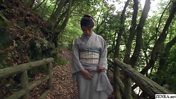 Amazingly beautiful JAV milf Akemi Horiuchi in a kimono flashes her lower body while outdoors in a forest before kneeling to perform a blowjob in HD with English subtitles