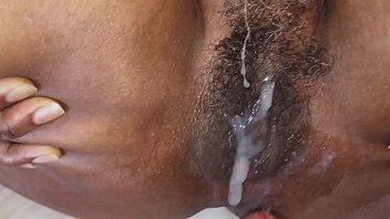 Black hairy MILF lets white cock cum over her wet ebony pussy