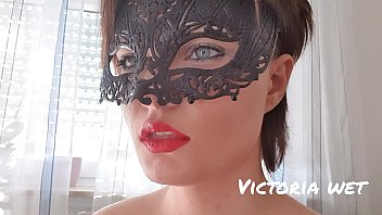 masked beautiful girl and fetish smoking a cigarette