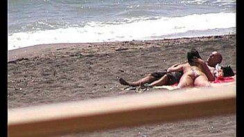 Hot babe gives blowjob to her guy on a beach