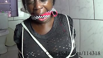 Manyvids.com/WatermelonButt black slave gagged with her own panties tries to get rid of the ropes