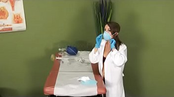 Brunette doctor playing with medical equipment